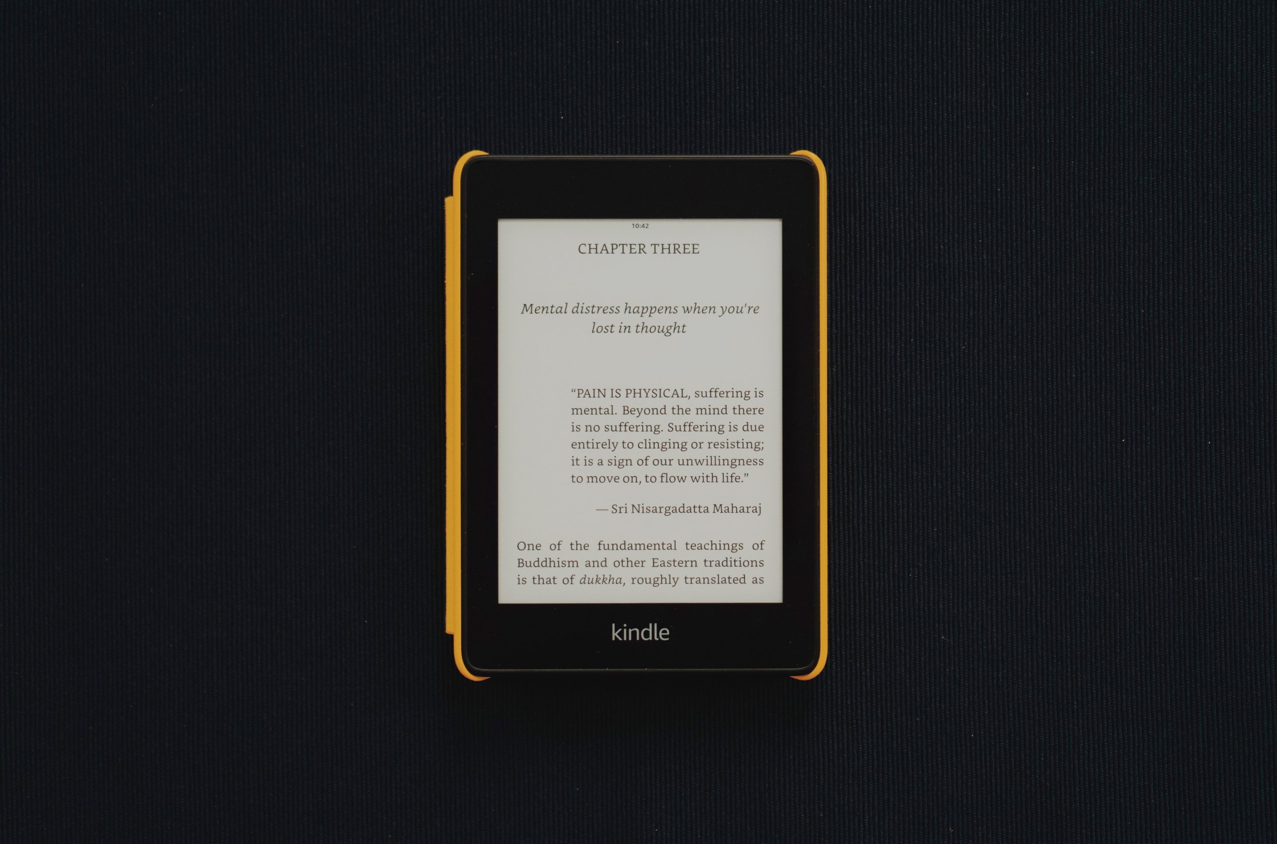 A Kindle showing the opening of Chapter Three, headed &ldquo;Mental distress happens when you&rsquo;re lost in thought&rdquo;, with a quote from Nisargadatta Maharaj