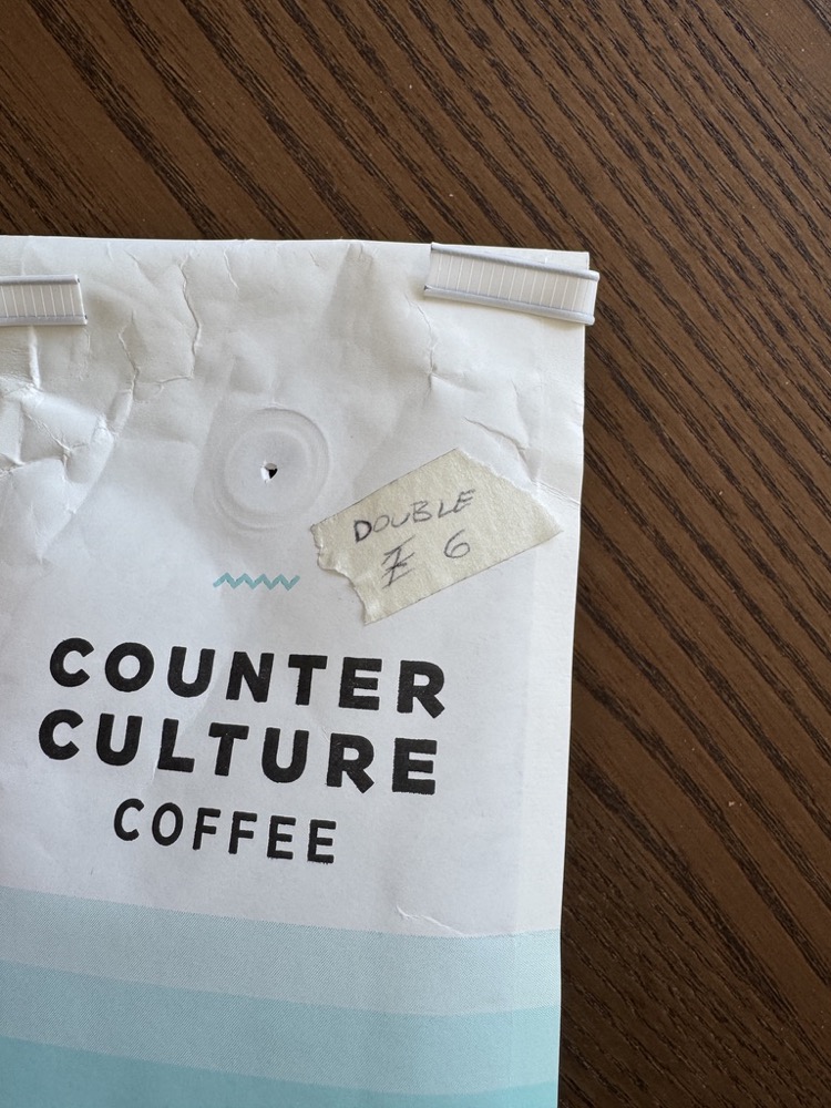 Masking tape on coffee bag with grind size written on it